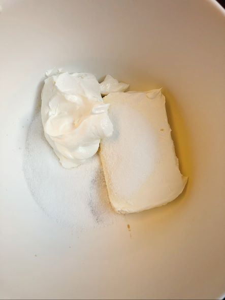 cream cheese filling ingredients in white bowl