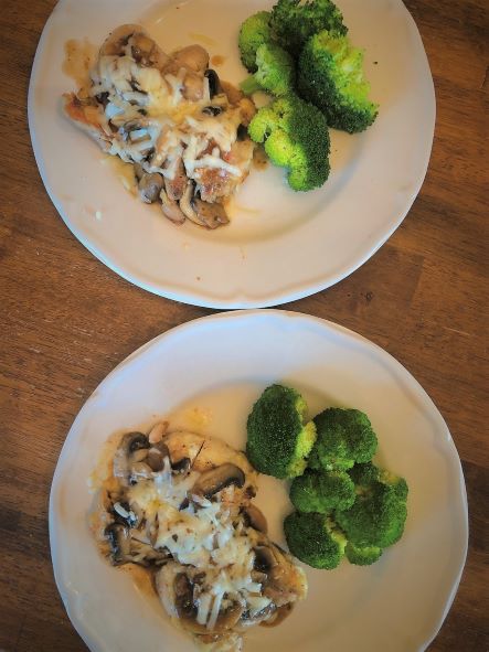 two plates of cheesy mushroom chicken and steamed broccoli