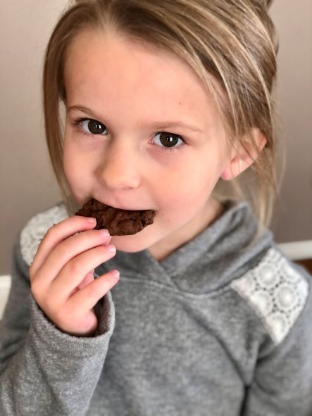kid eating chocolate chocolate chip cookie