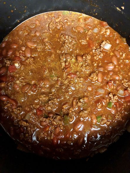 cooking curry chili in pot on stove