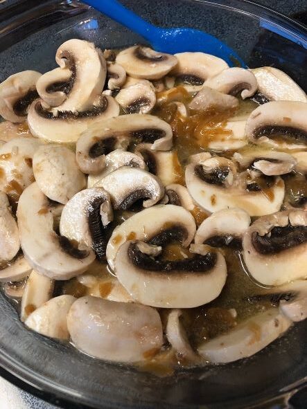 all ingredients combined in dish for mushroom rice casserole