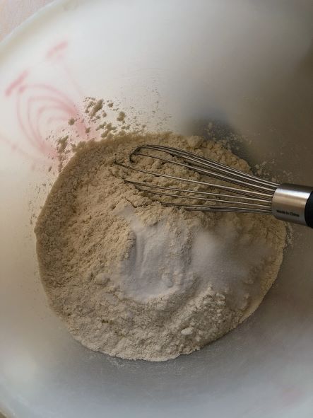 whisking together flour, salt and baking soda