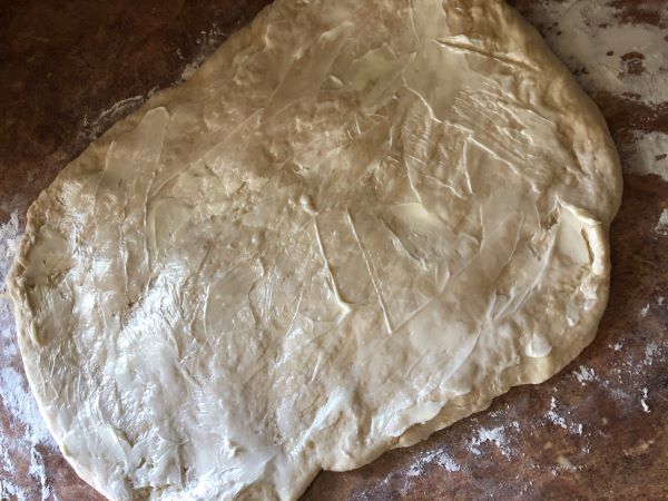 butter spread evenly over dough
