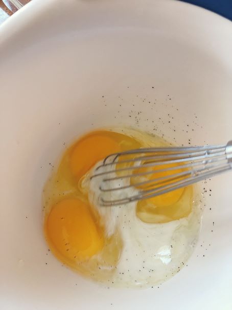 whisking scrambled eggs