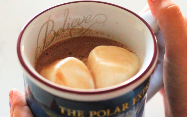 hot cocoa in a Polar Express mug with marshmallows